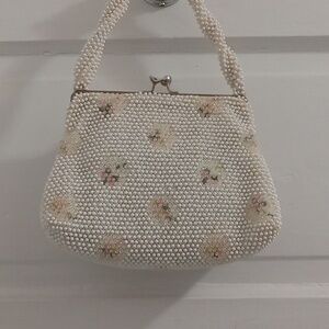Corde Bead white and flower twist top handbag